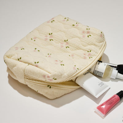 Woman wearing Pink Rose Urban Expressions Quilted Keeper Cosmetic & Travel Organizer Pouch 840611195425 View 1 | Pink Rose