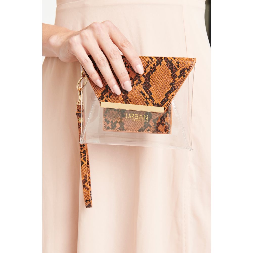 Woman wearing Rust Urban Expressions Reese Snake Wristlet NA-840611163431 View 1 | Rust