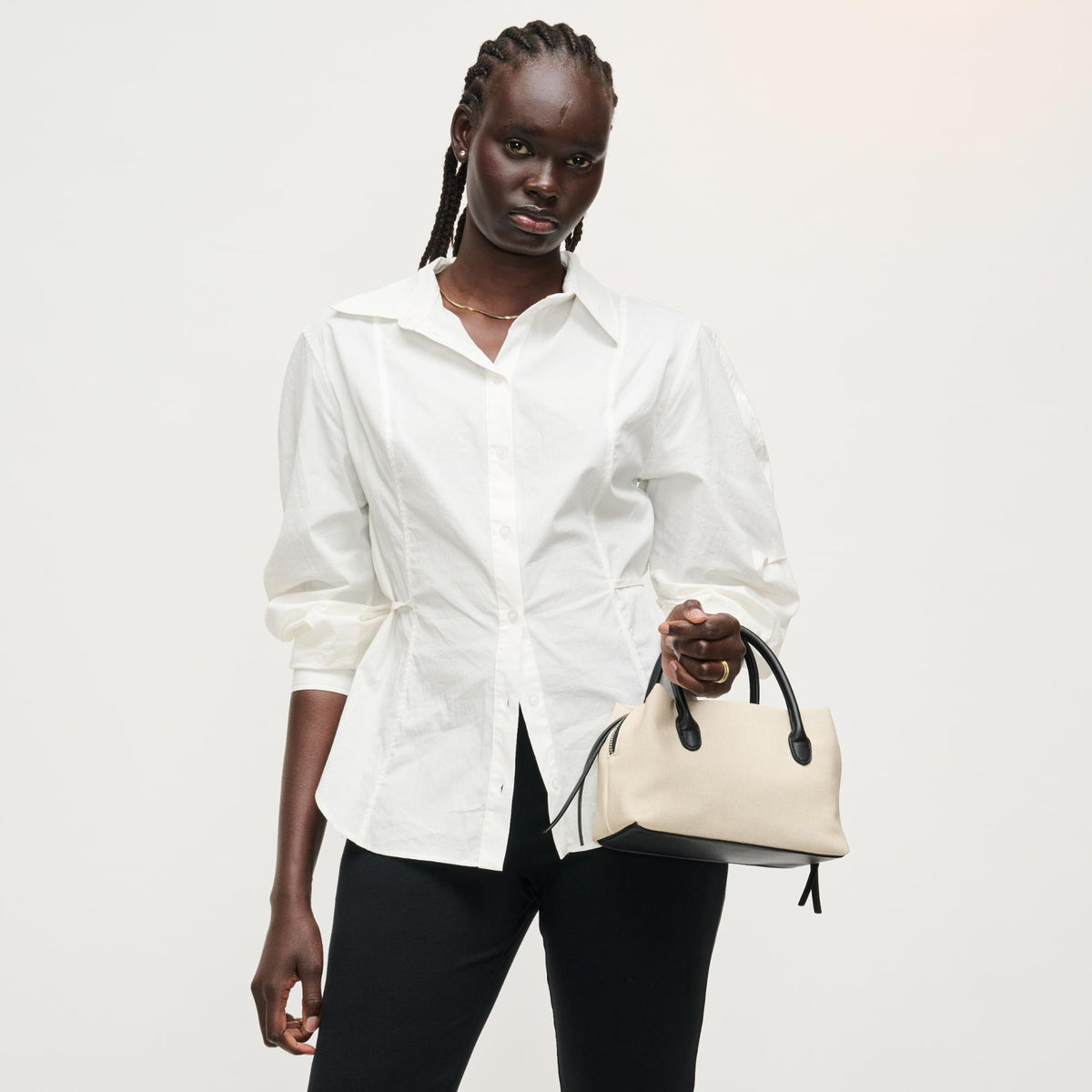 Woman wearing Ivory Black Urban Expressions Logan Crossbody 840504205330 View 4 | Ivory Black