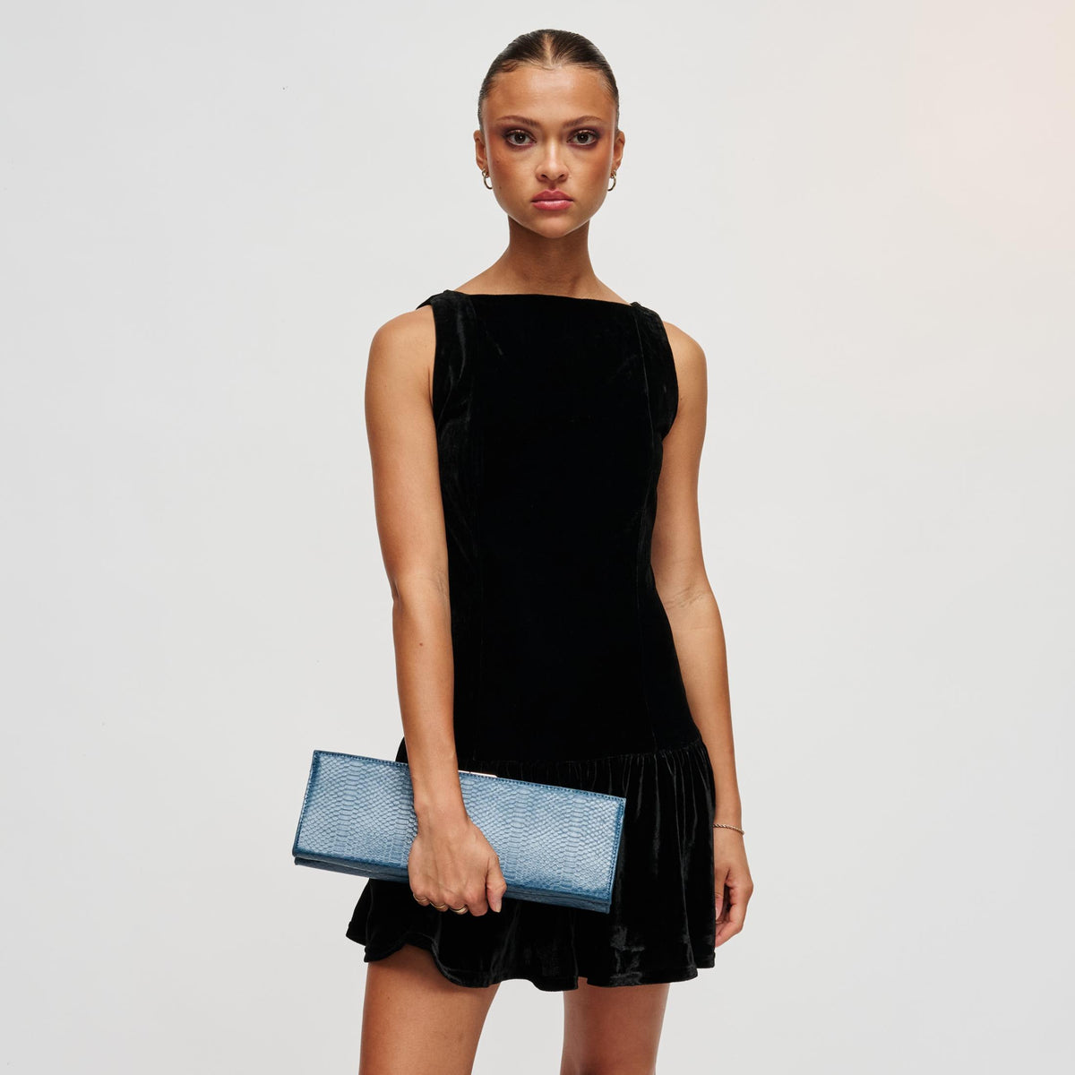 Woman wearing Denim Urban Expressions Nazlee - Snake Clutch 840504212581 View 3 | Denim