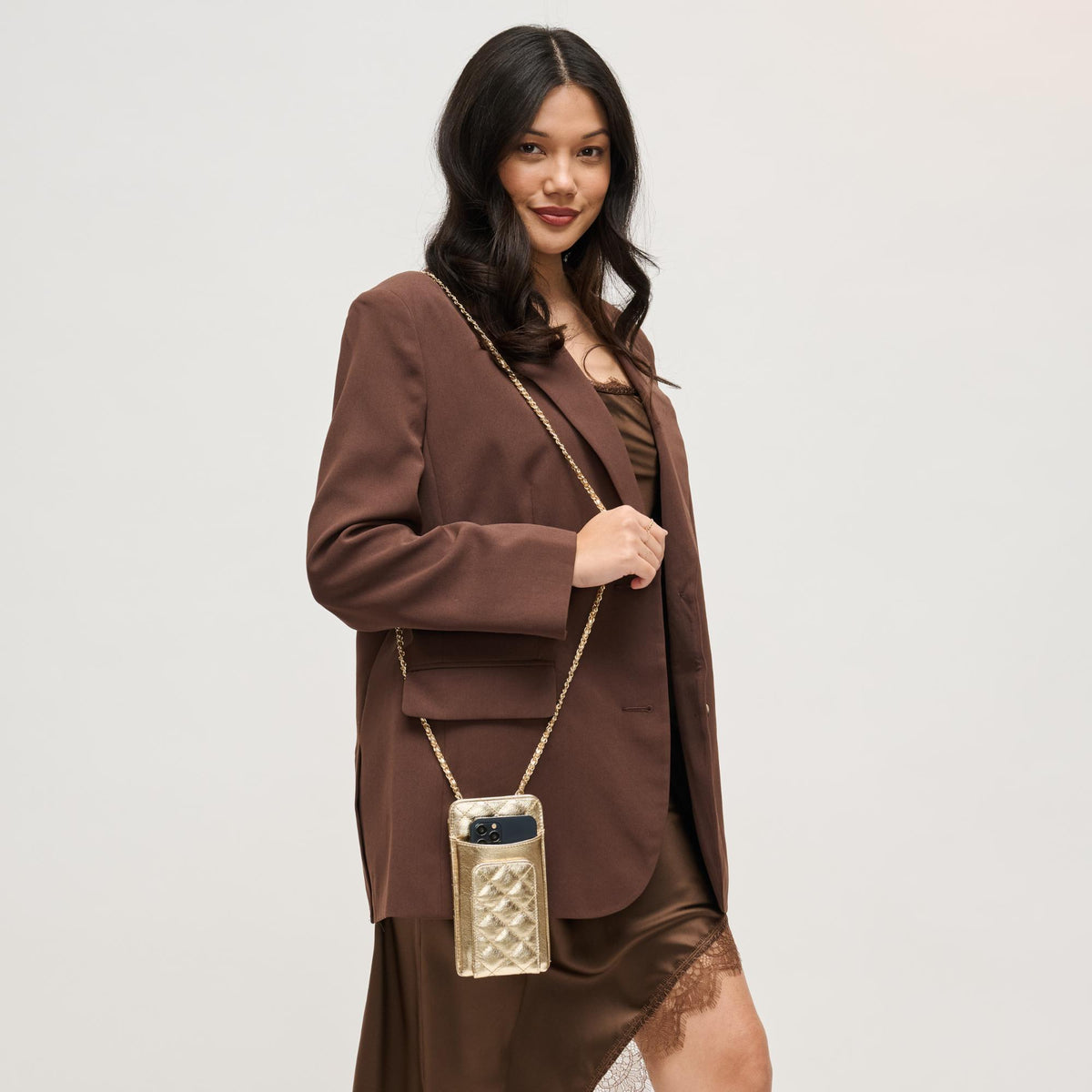 Woman wearing Light Gold Urban Expressions Brianna 2.0 Cell Phone Crossbody 840504203787 View 1 | Light Gold
