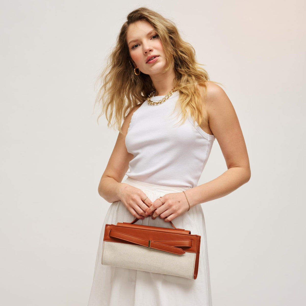 Woman wearing Ivory Tan Urban Expressions Emerly Clutch 840504205736 View 1 | Ivory Tan