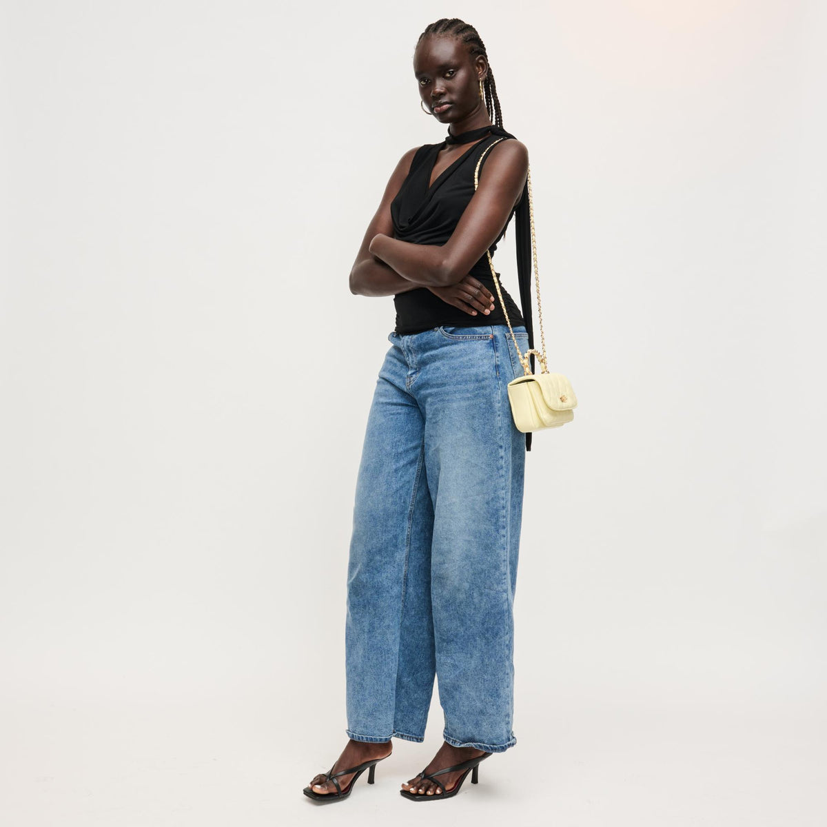 Woman wearing Butter Urban Expressions Leo Crossbody 840504205095 View 4 | Butter