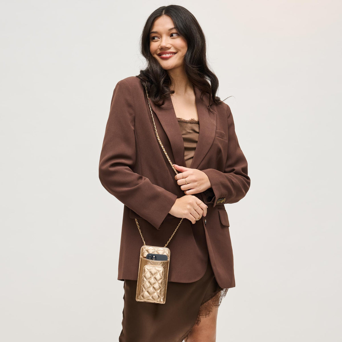 Woman wearing Rose Gold Urban Expressions Brianna 2.0 Cell Phone Crossbody 840504203794 View 1 | Rose Gold