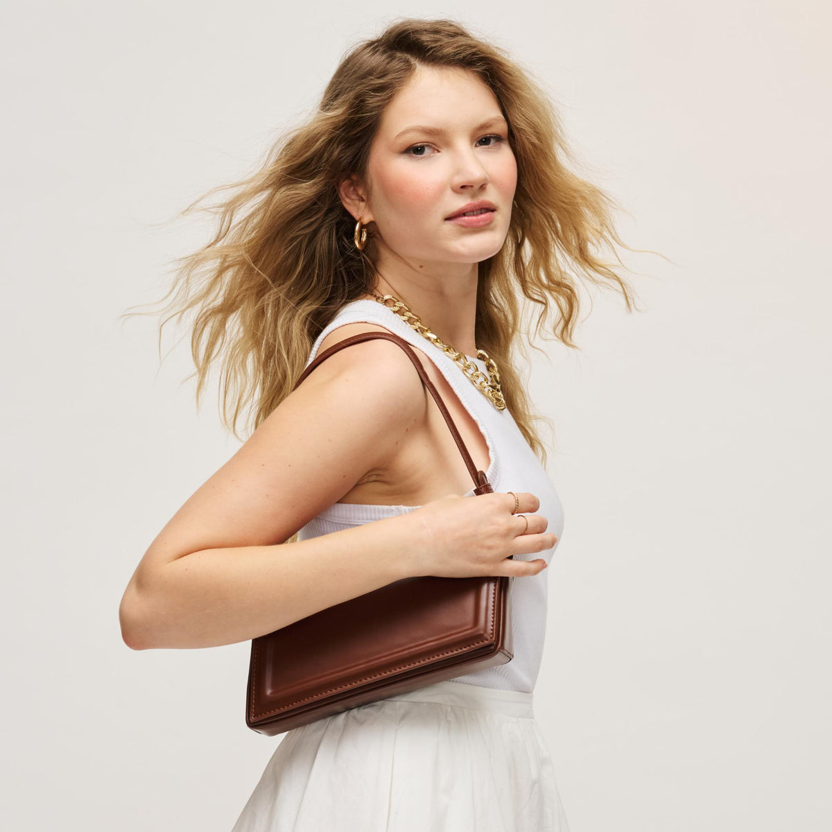 Woman wearing Chocolate Urban Expressions Sleek Contour Crossbody 840504200229 View 3 | Chocolate