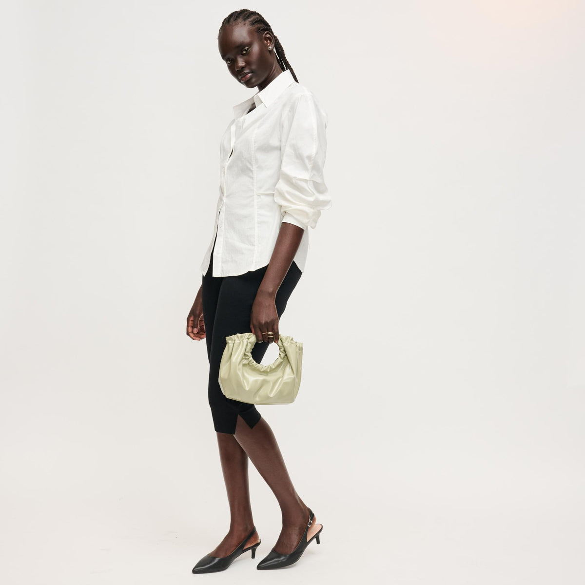 Woman wearing Sage Urban Expressions Myles Crossbody 840504204739 View 4 | Sage