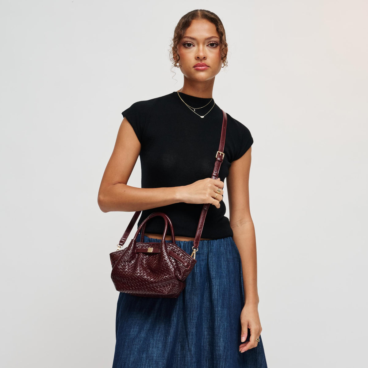 Woman wearing Burgundy Urban Expressions Selena - Embossed Woven Crossbody 840504212147 View 2 | Burgundy