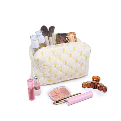 Woman wearing Lemon Urban Essentials Quilted Keeper Cosmetic & Travel Organizer Pouch 840611195432 View 1 | Lemon
