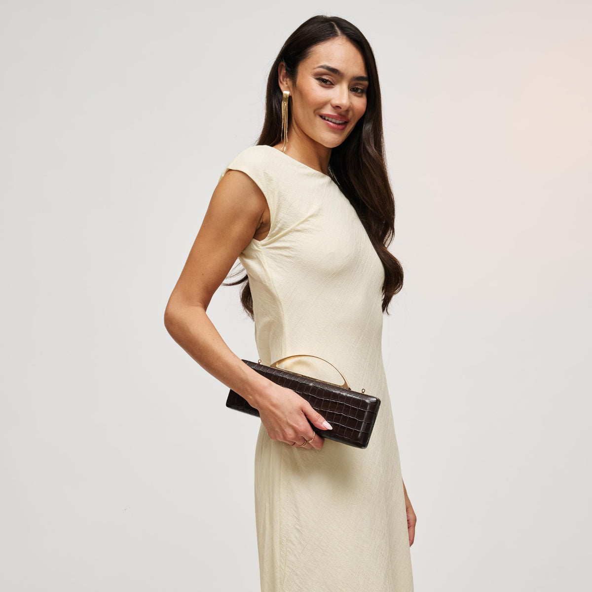Woman wearing Chocolate Urban Expressions Banks Clutch 840504212055 View 2 | Chocolate