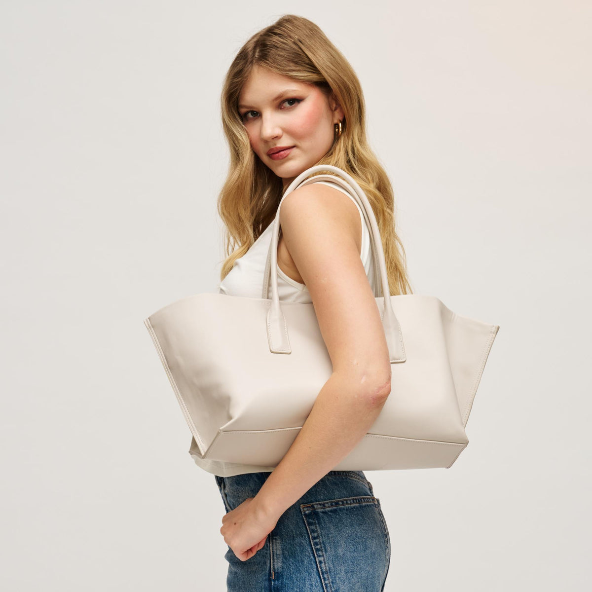 Woman wearing Bone Urban Expressions Levi Tote 840504205279 View 1 | Bone