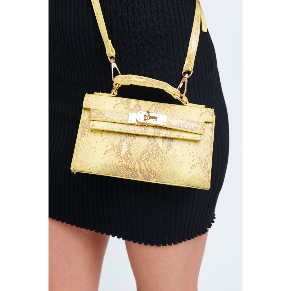 Woman wearing Canary Urban Expressions Georgina Snake Crossbody 840611171986 View 2 | Canary