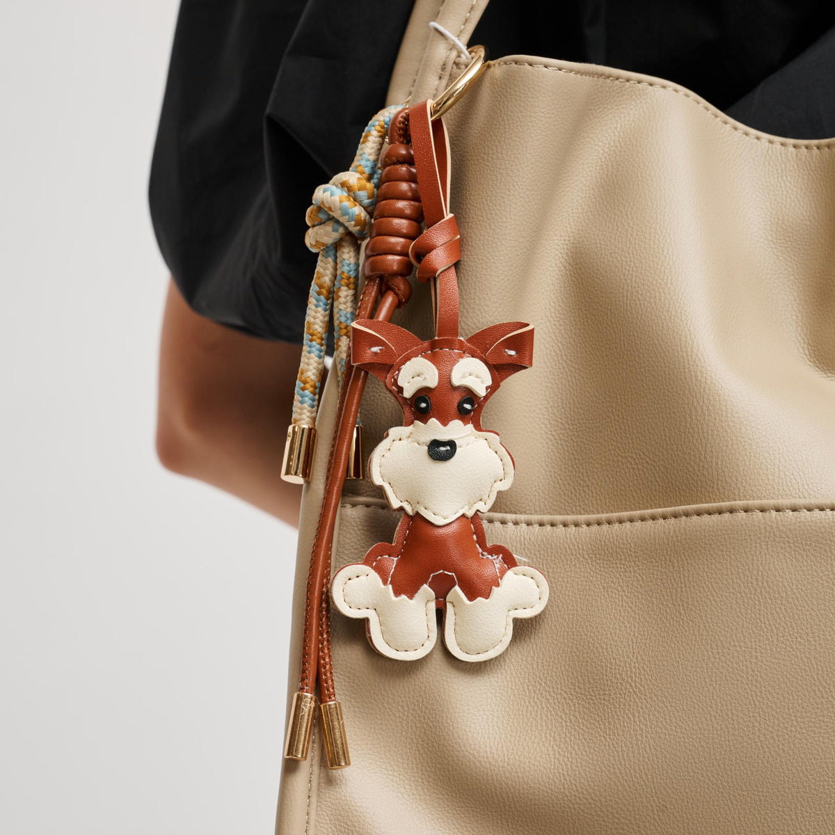 Woman wearing Tan Urban Expressions Storm Keychain Charm 840504201042 View 1 | Tan