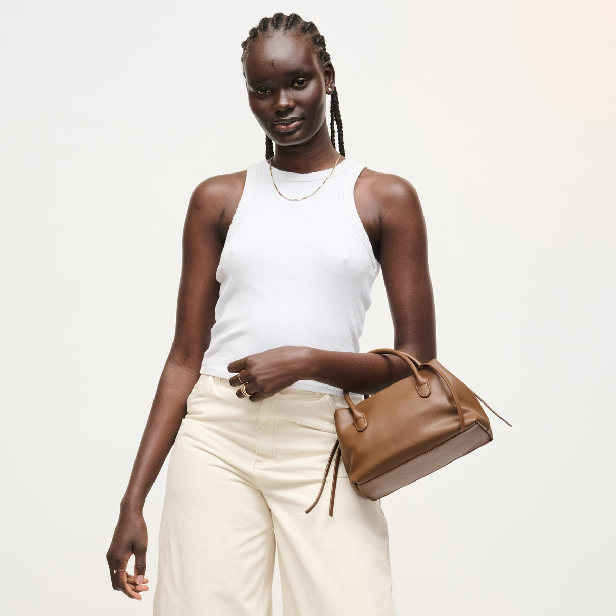Woman wearing Chocolate Urban Expressions Logan Crossbody 840504205361 View 4 | Chocolate