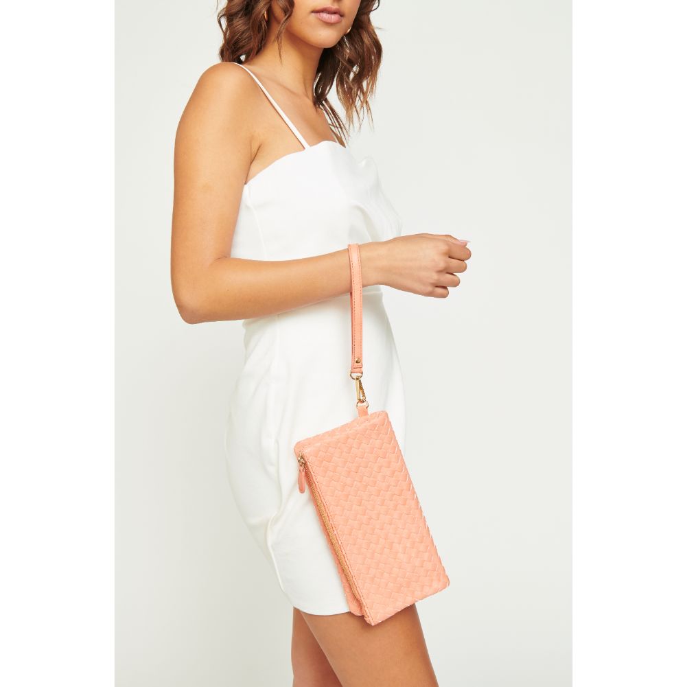 Woman wearing Pink Urban Expressions Trisha Wristlet 840611161963 View 2 | Pink