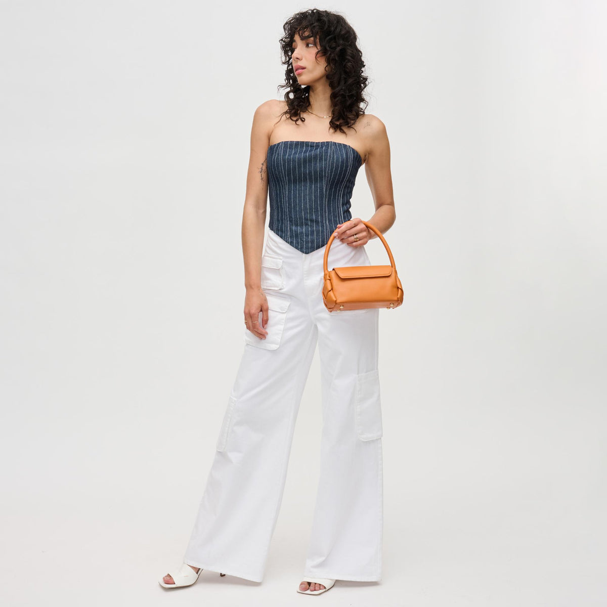 Woman wearing Tangerine Urban Expressions Devin Crossbody 840611192042 View 3 | Tangerine
