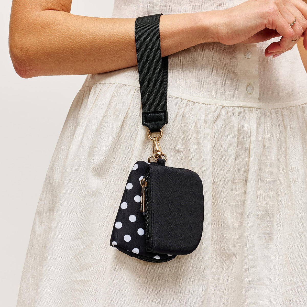 Woman wearing Black Urban Expressions Link & Carry - Polka Dot Wristlet 840504202704 View 1 | Black