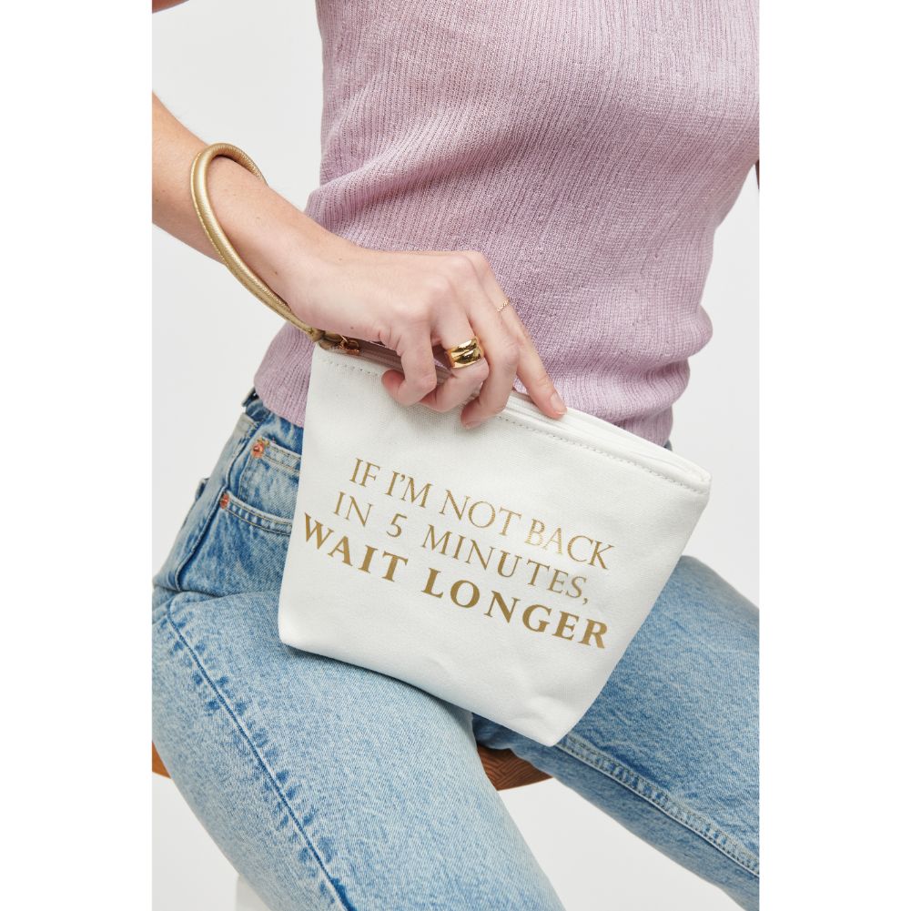 Woman wearing But First Urban Expressions Carry-All Writing Wristlet 818209012461 View 1 | But First
