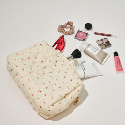 Woman wearing Cherry Urban Essentials Quilted Keeper Cosmetic & Travel Organizer Pouch 840611195449 View 1 | Cherry