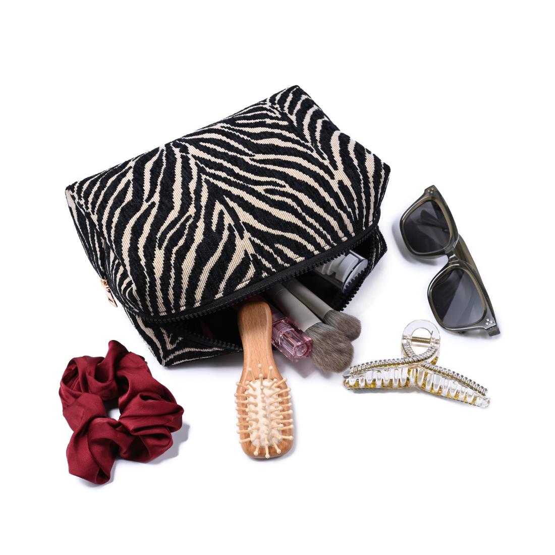 Woman wearing Natural Black Urban Essentials Zebrini Cosmetic & Travel Organizer Pouch 840611197825 View 2 | Natural Black