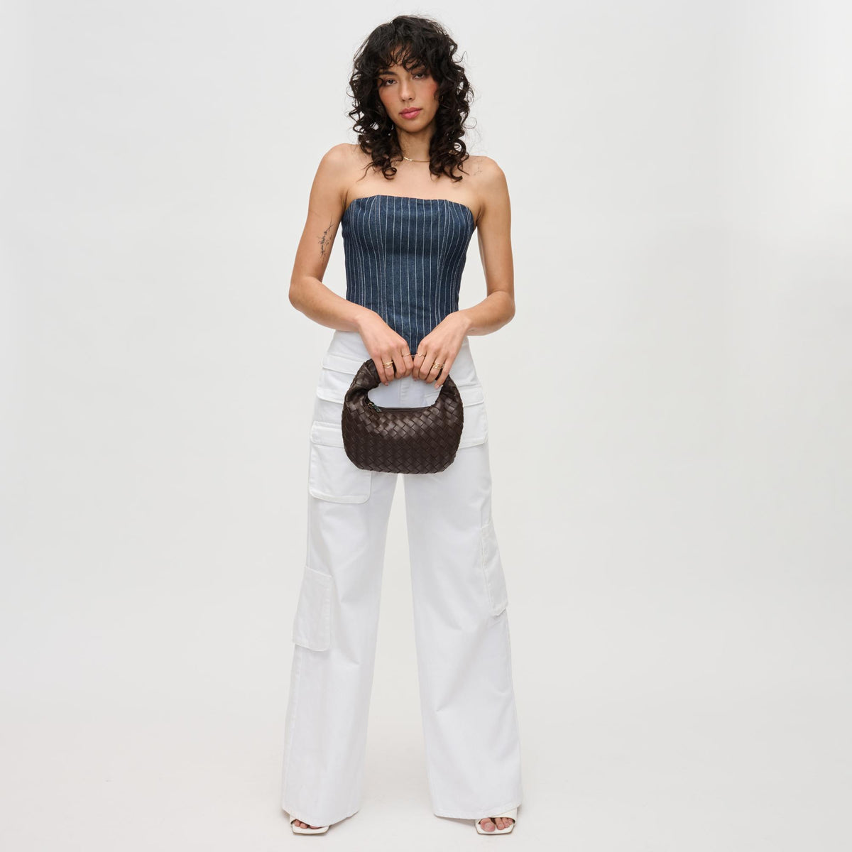 Woman wearing Espresso Urban Expressions Tracy - Woven Clutch 840611192943 View 3 | Espresso