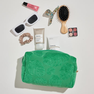 Woman wearing Green Urban Essentials Palm Breeze Cosmetic & Travel Organizer Pouch 840611195340 View 1 | Green
