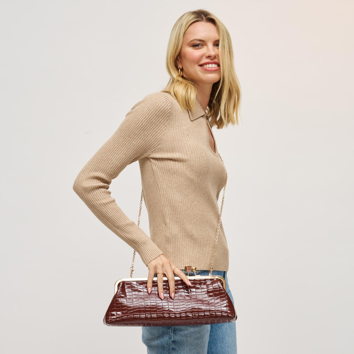 Woman wearing Chocolate Urban Expressions Piper Clutch 840504200731 View 3 | Chocolate