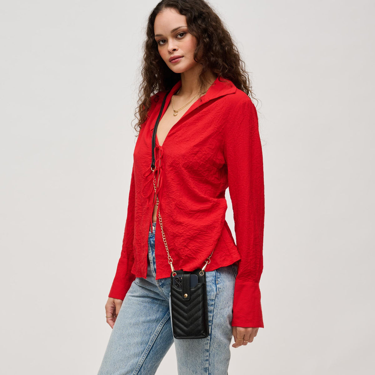 Woman wearing Black Urban Expressions Claire - Chevron Stitch Cell Phone Crossbody 840611113184 View 2 | Black