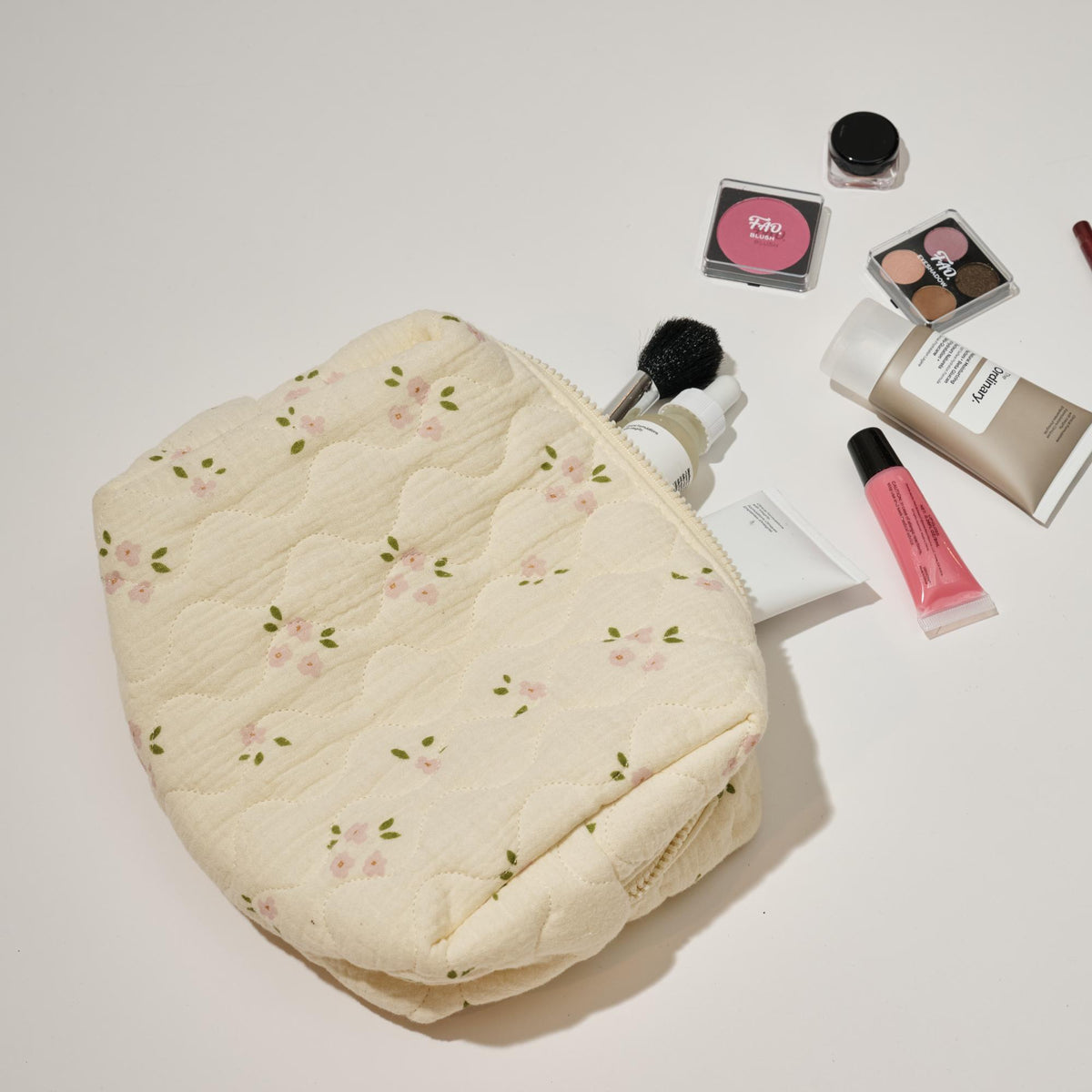 Woman wearing Pink Rose Urban Expressions Quilted Keeper Cosmetic & Travel Organizer Pouch 840611195425 View 2 | Pink Rose