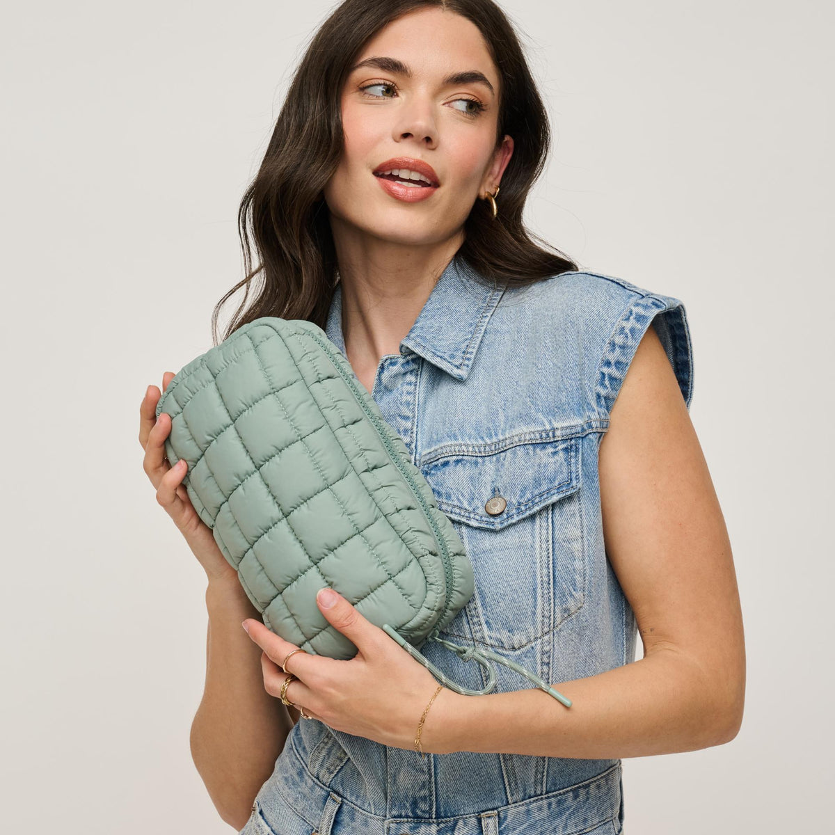 Woman wearing Sage Urban Expressions Cloud Nine - Quilted Puffer Nylon Cosmetic Pouch 840611143808 View 1 | Sage