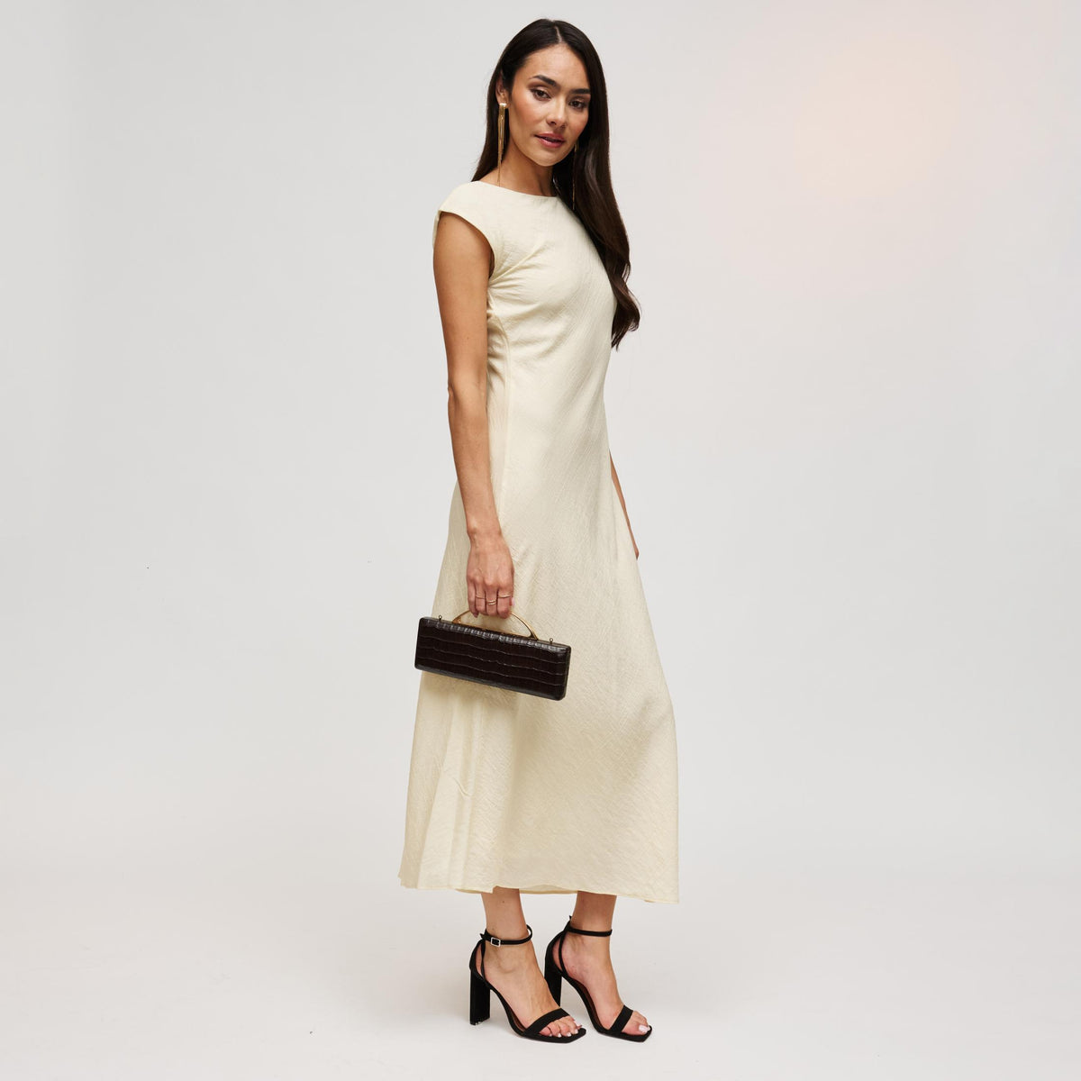 Woman wearing Chocolate Urban Expressions Banks Clutch 840504212055 View 3 | Chocolate