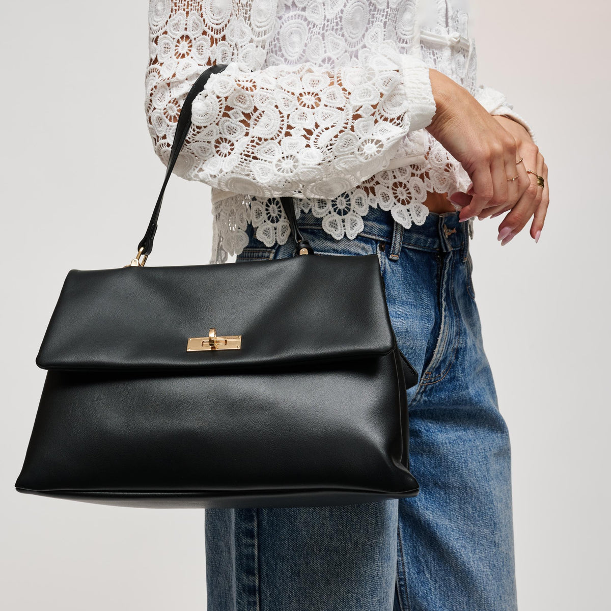 Woman wearing Black Urban Expressions Arrow Satchel 840504212925 View 2 | Black