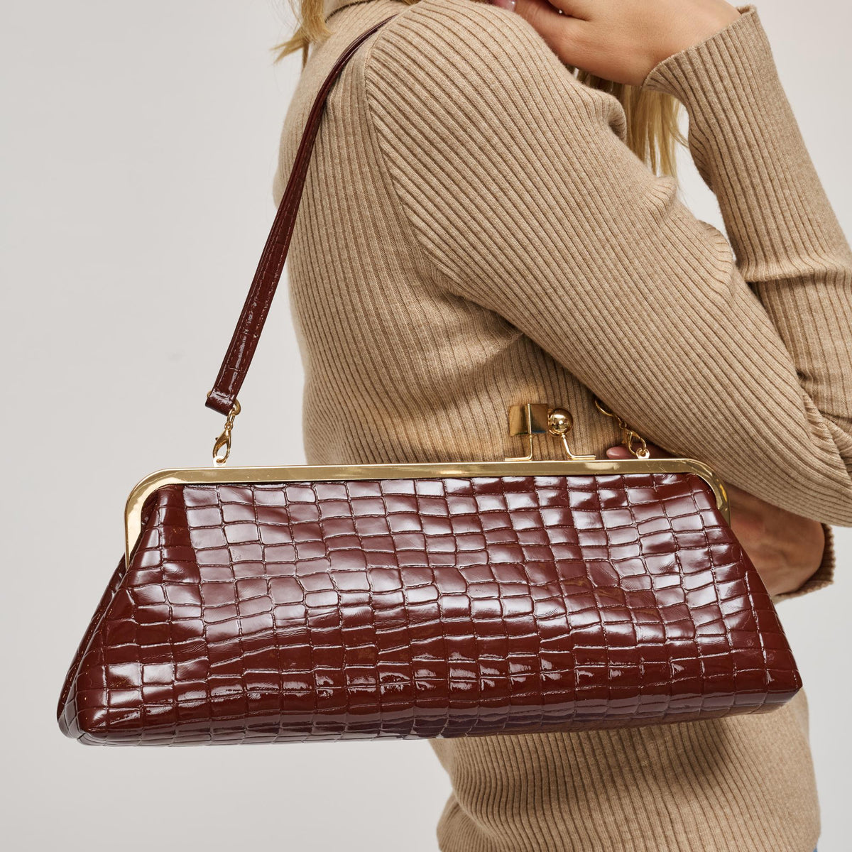 Woman wearing Chocolate Urban Expressions Piper Clutch 840504200731 View 1 | Chocolate