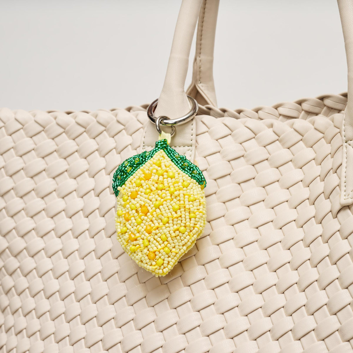Woman wearing Lemon Urban Expressions Fruity Keychain Charm 840504209192 View 2 | Lemon