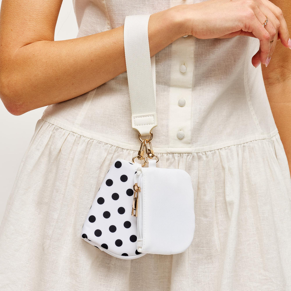 Woman wearing White Urban Expressions Link & Carry - Polka Dot Wristlet 840504202735 View 1 | White