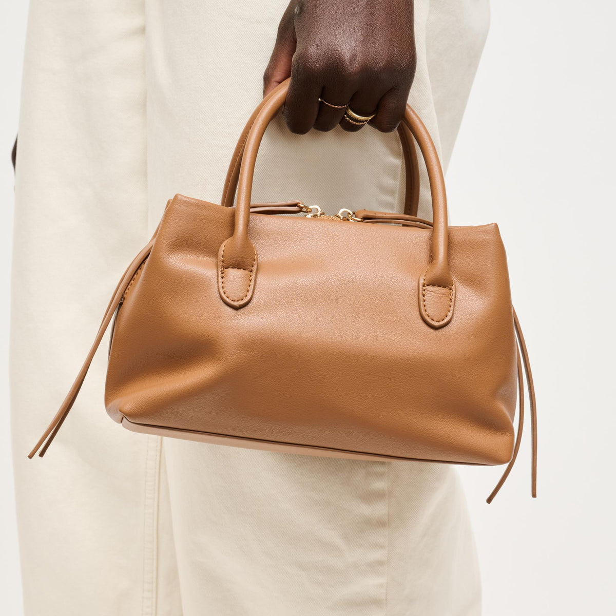 Woman wearing Camel Urban Expressions Logan Crossbody 840504205354 View 1 | Camel