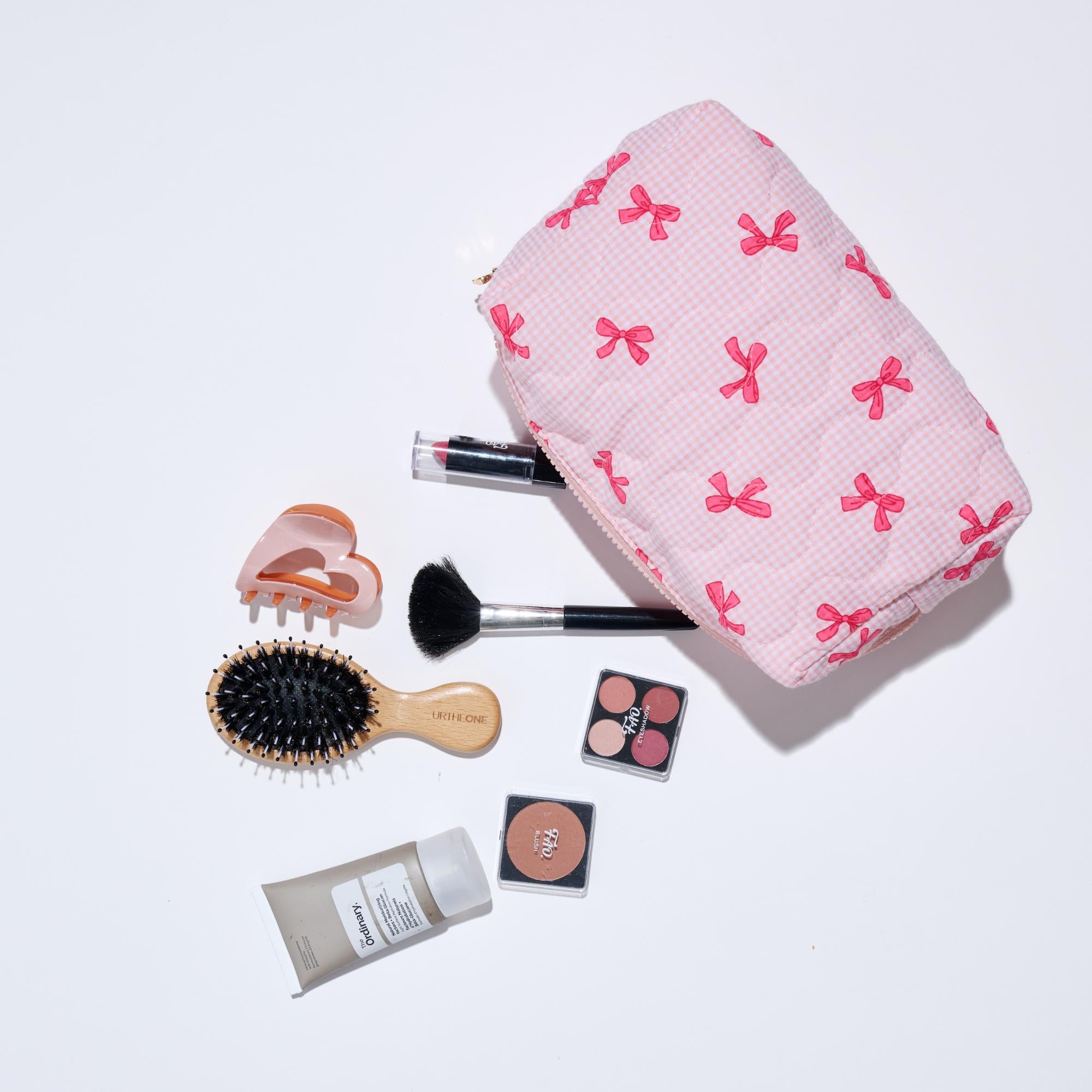 Woman wearing Pink Urban Expressions Bow & Tell Cosmetic Pouch 840611197801 View 1 | Pink