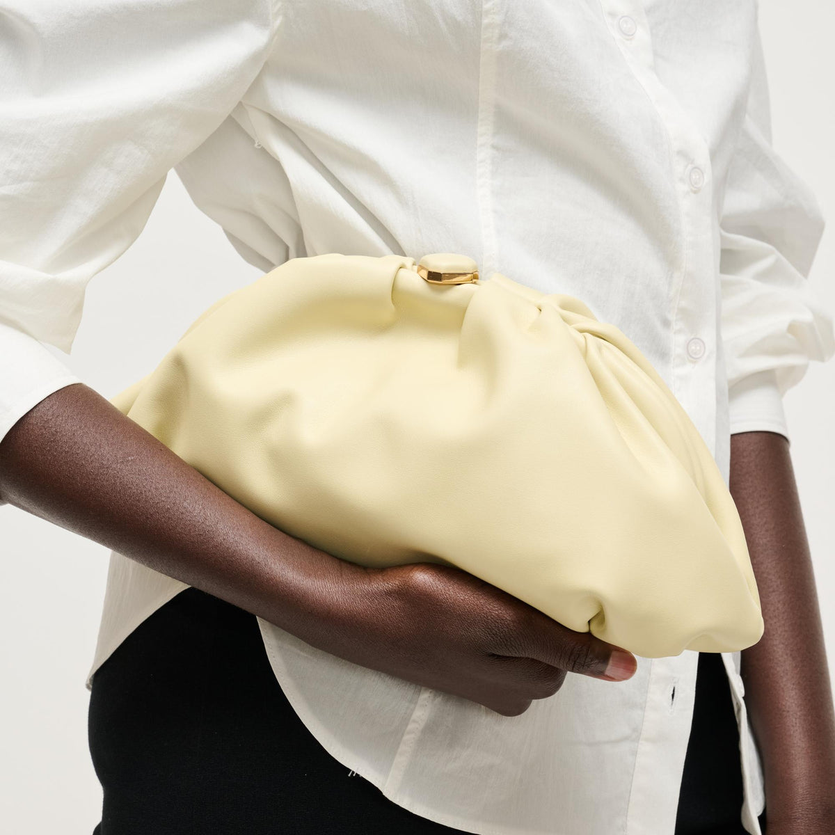 Woman wearing Butter Urban Expressions Jennifer Clutch 840504208232 View 1 | Butter