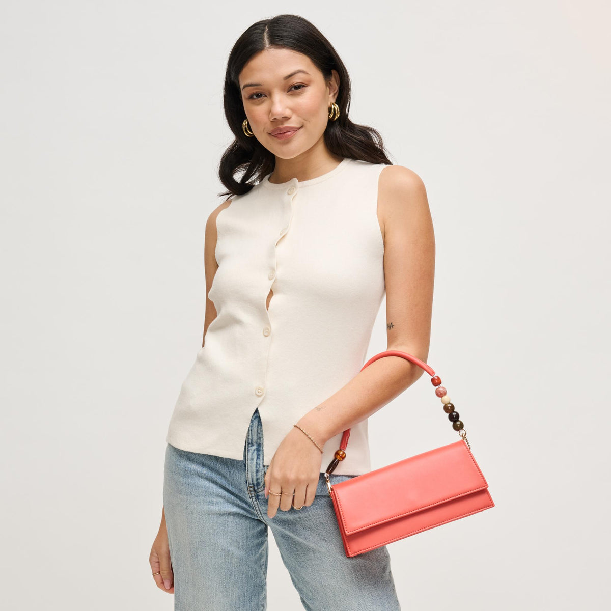 Woman wearing Coral Urban Expressions Brooks Crossbody 840504206658 View 3 | Coral