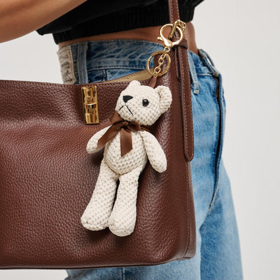 Woman wearing Cream Urban Expressions Clay Keychain Charm 840504201011 View 1 | Cream