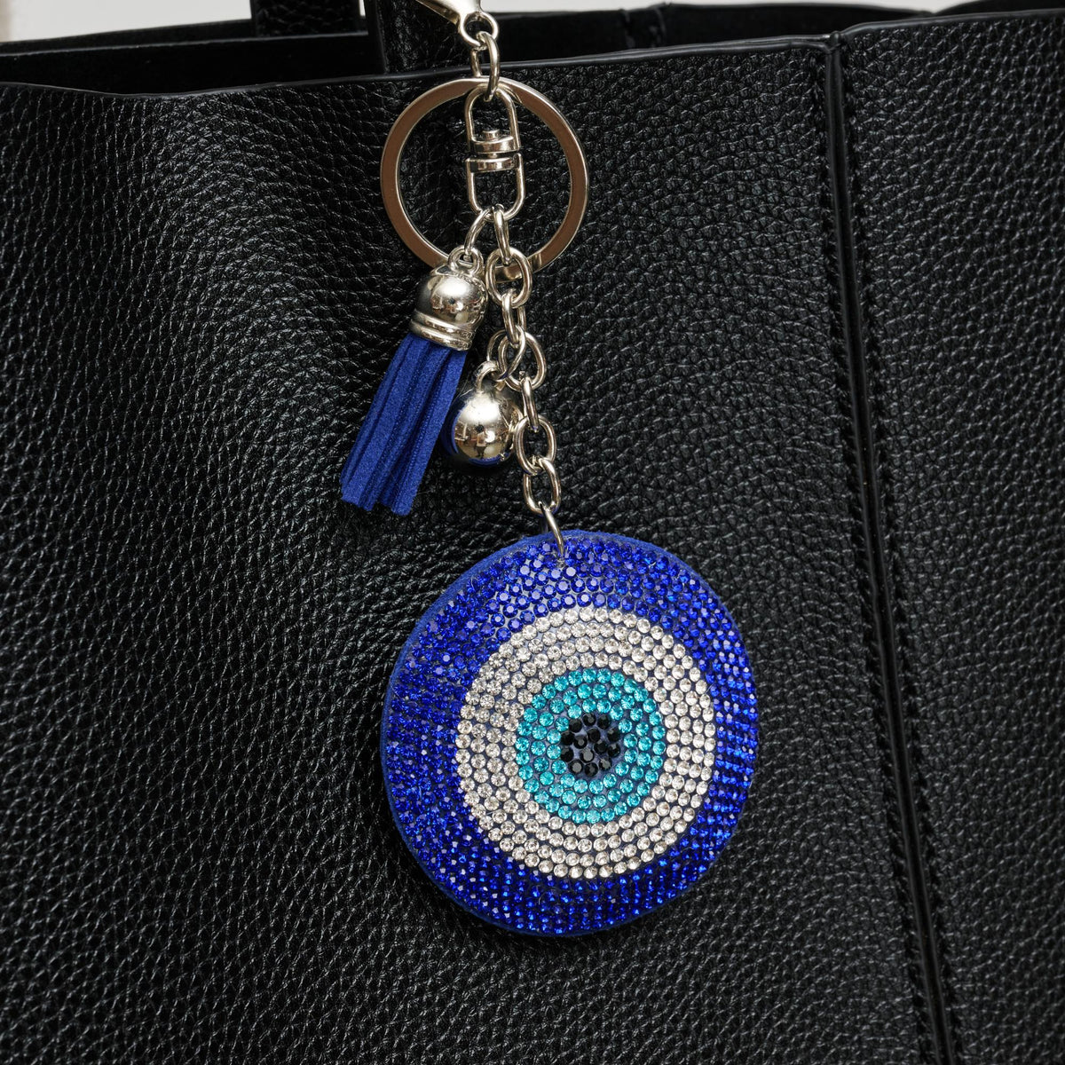 Woman wearing Blue Urban Expressions Elysian Eye Hanging Charm 840611196262 View 1 | Blue