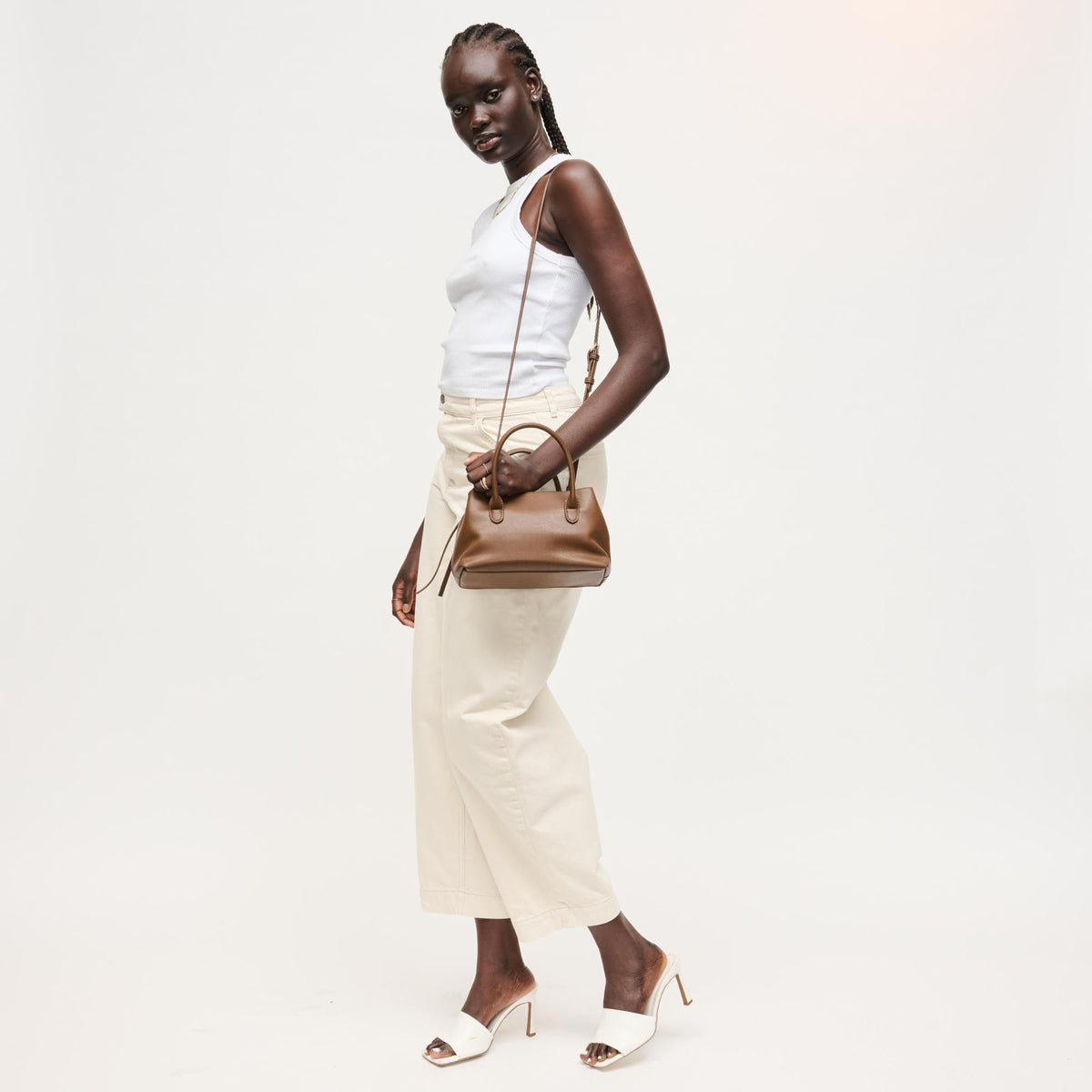 Woman wearing Chocolate Urban Expressions Logan Crossbody 840504205361 View 2 | Chocolate