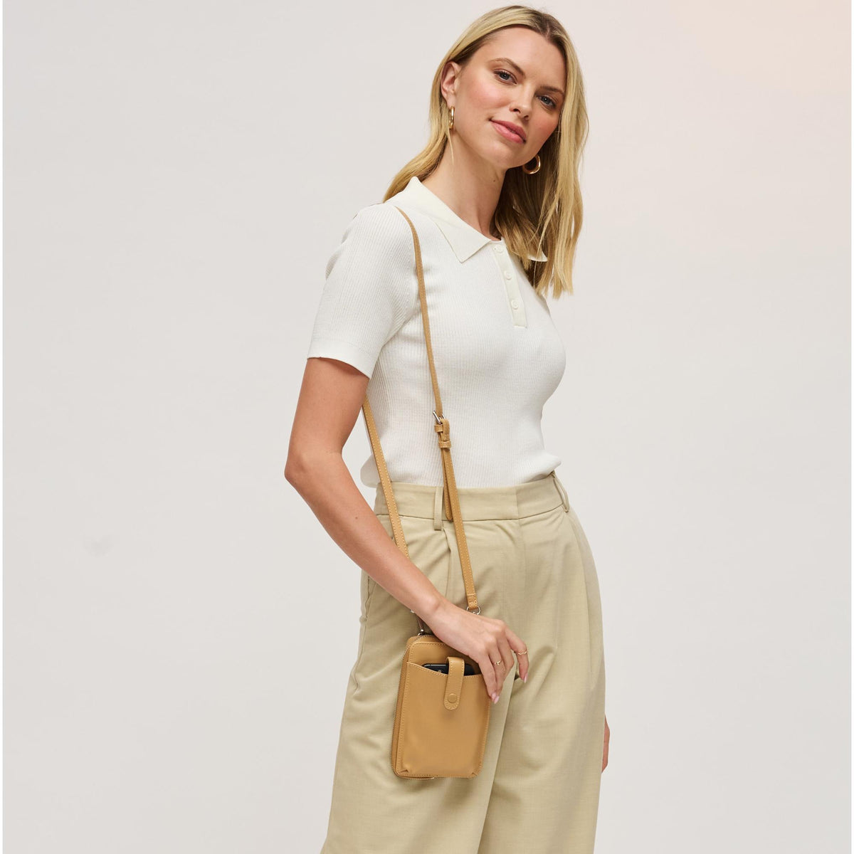 Woman wearing Tan Urban Expressions Carol Cell Phone Crossbody 840504201226 View 1 | Tan