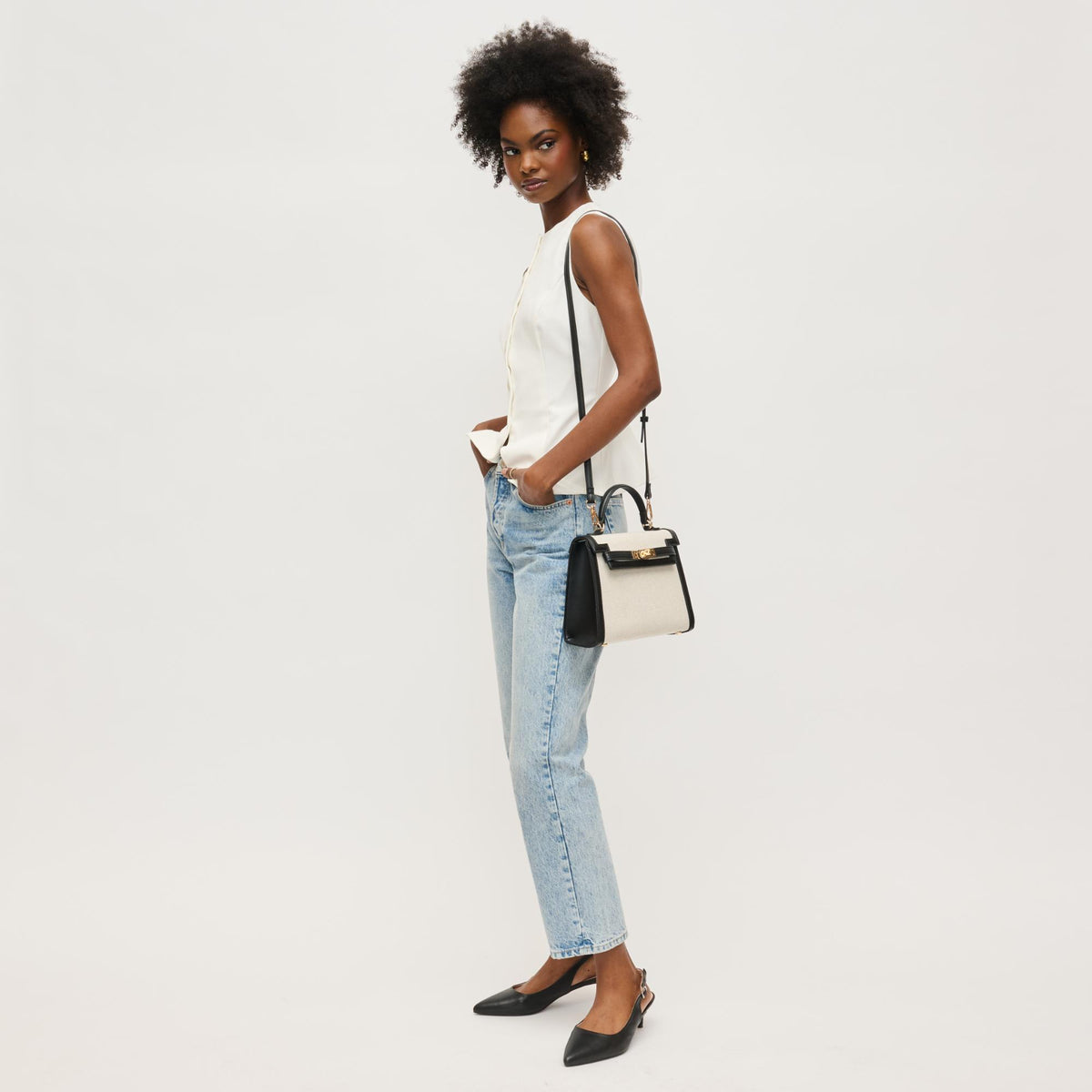 Woman wearing Black Ivory Urban Expressions Cher Clutch 840611146328 View 4 | Black Ivory