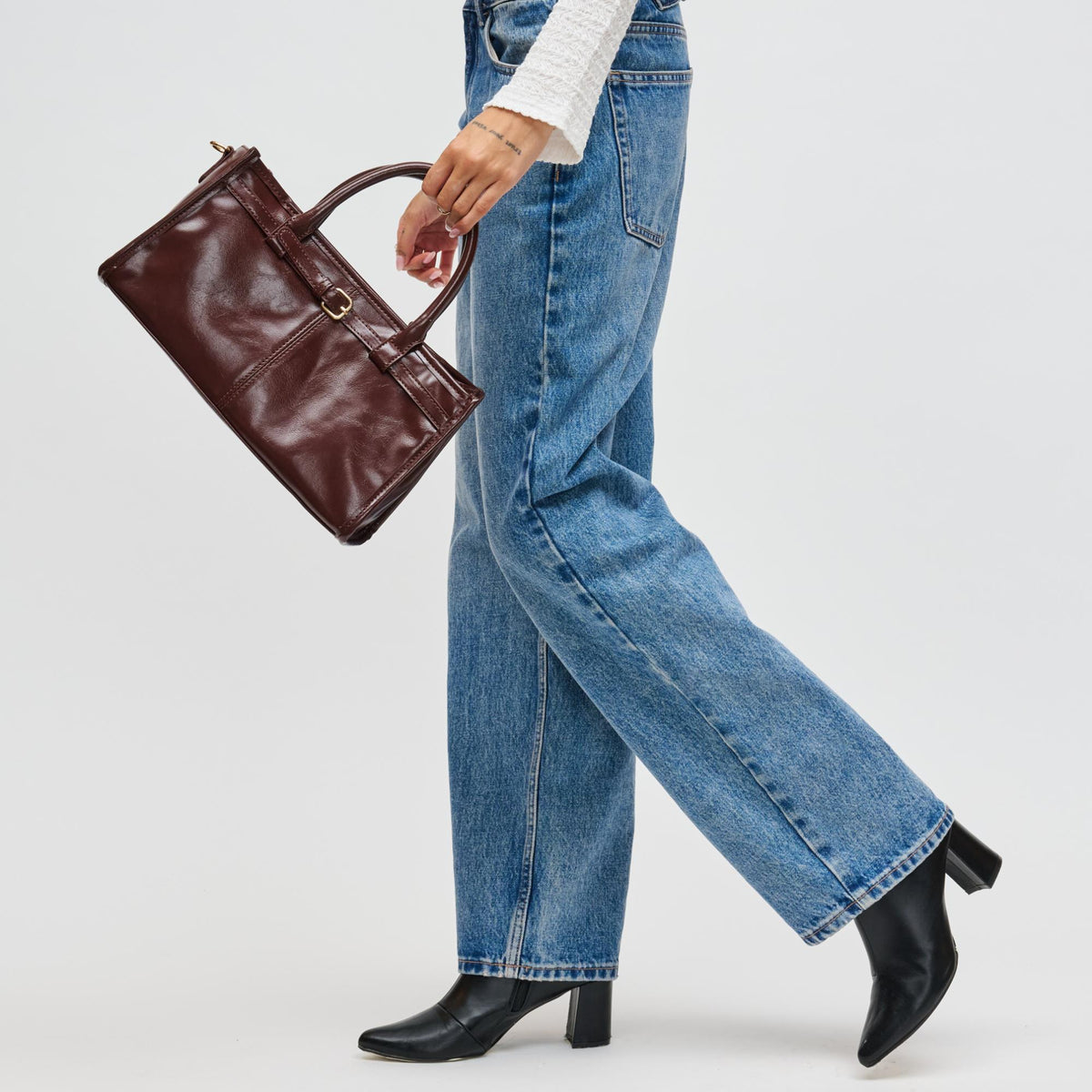 Woman wearing Chocolate Urban Expressions Joanna Crossbody 840611198204 View 4 | Chocolate