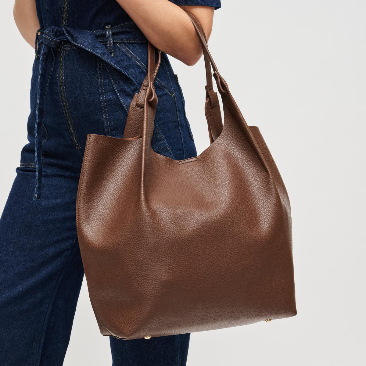 Woman wearing Chocolate Urban Expressions Maeve Tote 840611198884 View 4 | Chocolate