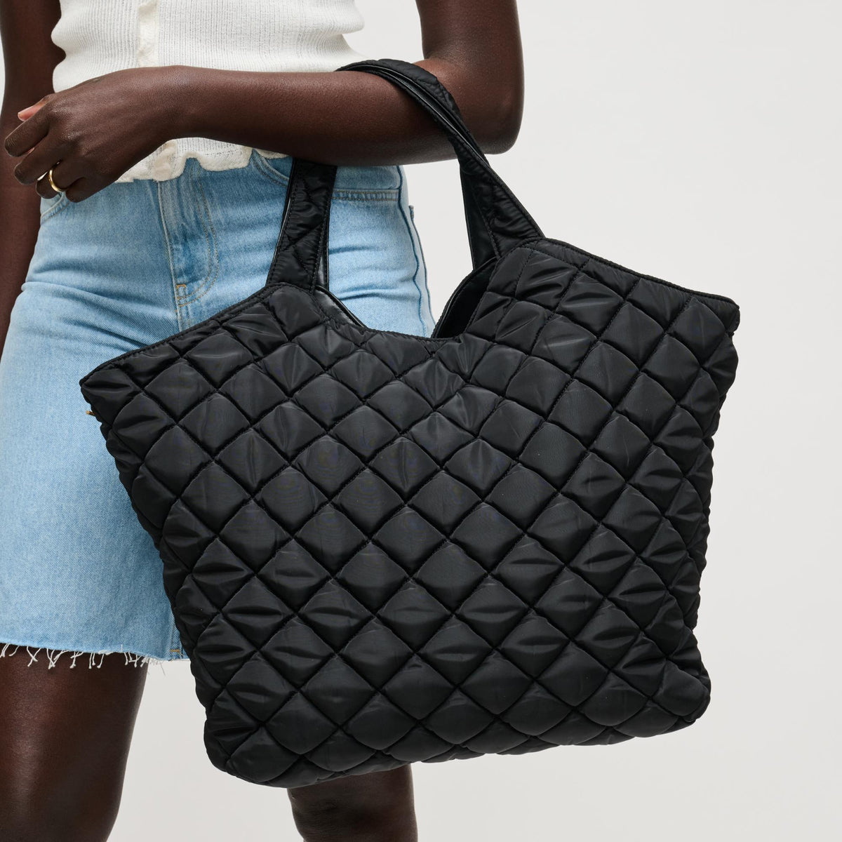 Woman wearing Black Urban Expressions Remmi Tote 840504204036 View 1 | Black