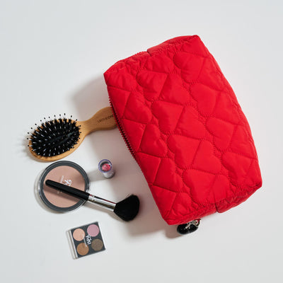Woman wearing Red Urban Essentials Pull My Heart Cosmetic & Travel Organizer Pouch 840611196972 View 1 | Red