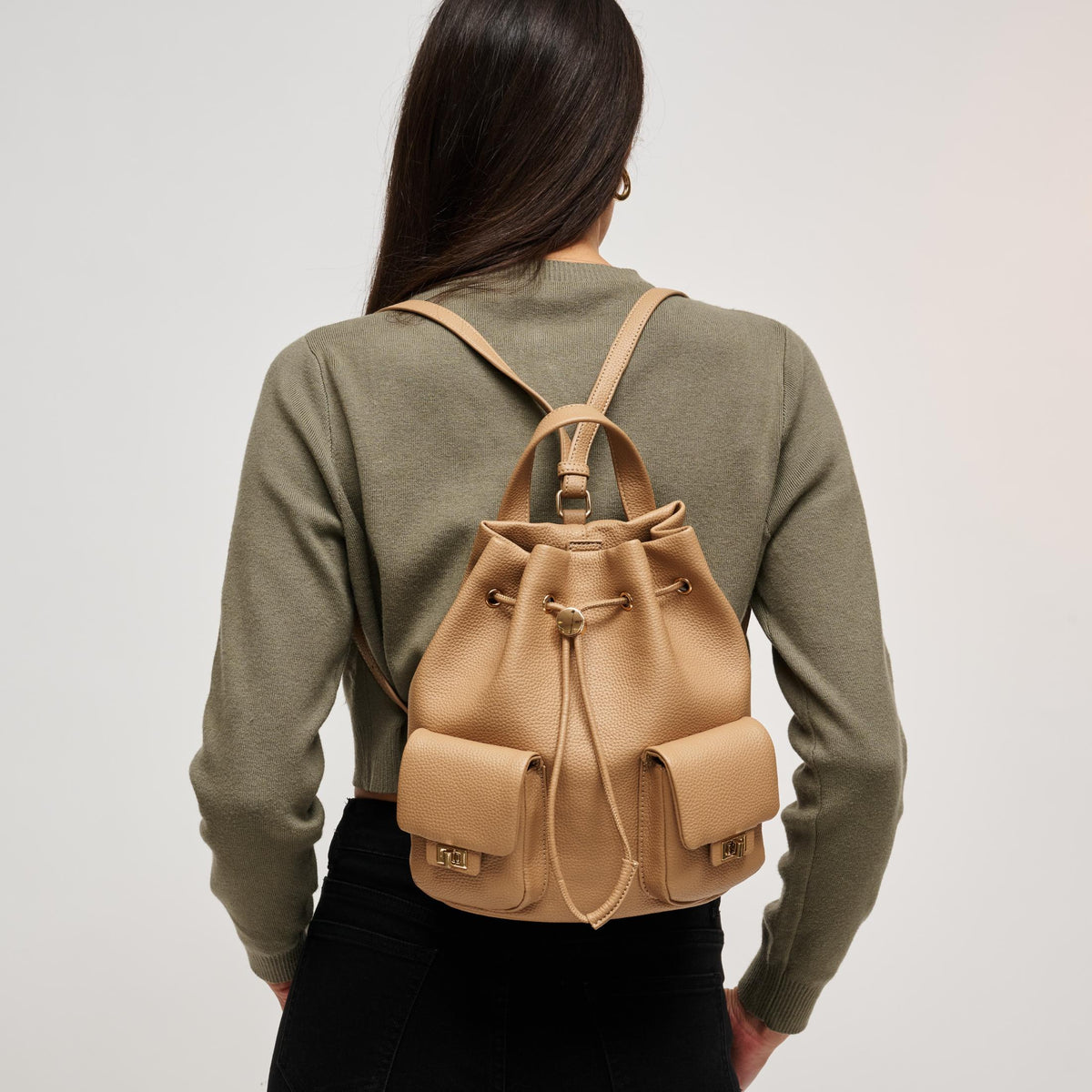 Woman wearing Natural Urban Expressions Clearfield Backpack 840504212383 View 2 | Natural