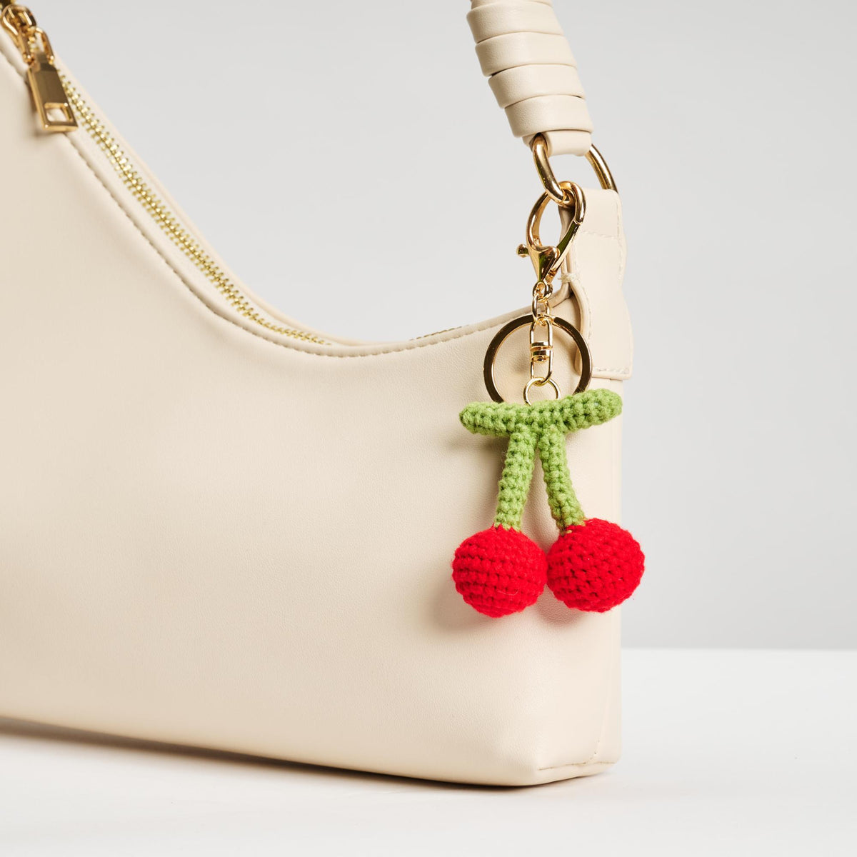 Woman wearing Cherry Urban Expressions Grenadine Keychain Charm 840611150608 View 2 | Cherry