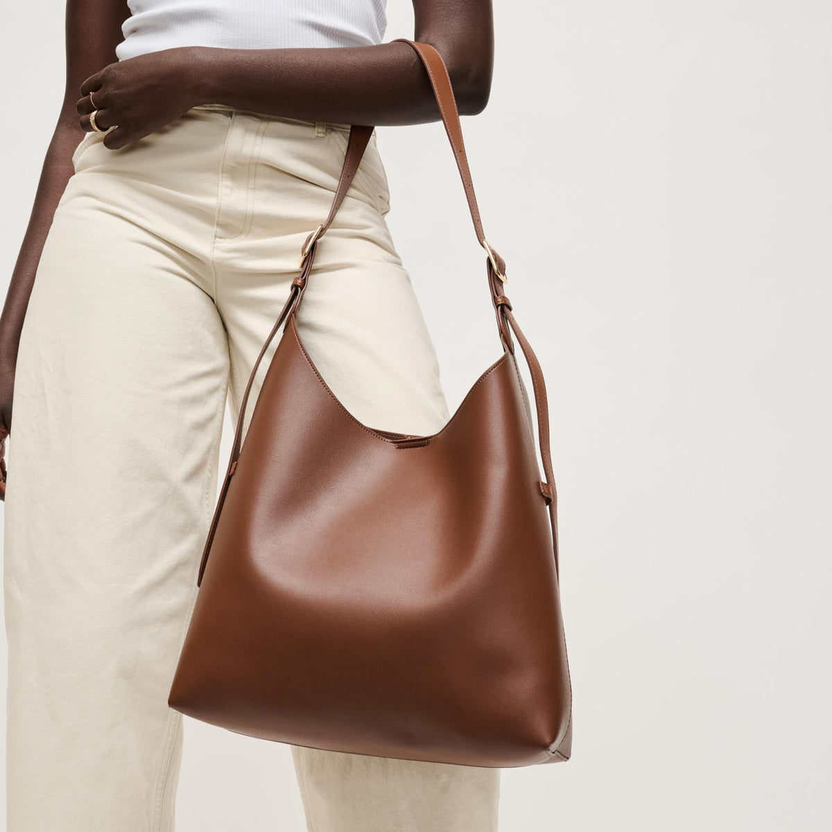 Woman wearing Chocolate Urban Expressions Maria Hobo 840504206269 View 1 | Chocolate
